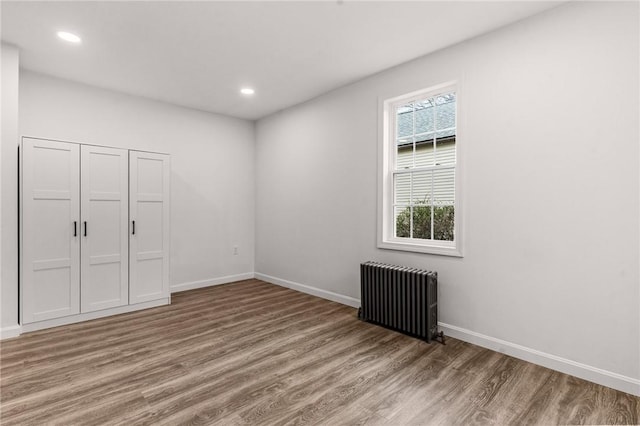 5 Cottage St, Westerly, RI 02891 - interior space featuring recessed lighting, baseboards, radiator, and wood finished floors