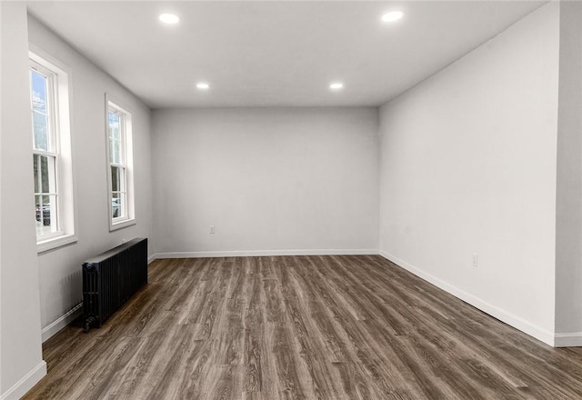 5 Cottage St, Westerly, RI 02891 - spare room featuring dark wood-style flooring, radiator heating unit, recessed lighting, and baseboards
