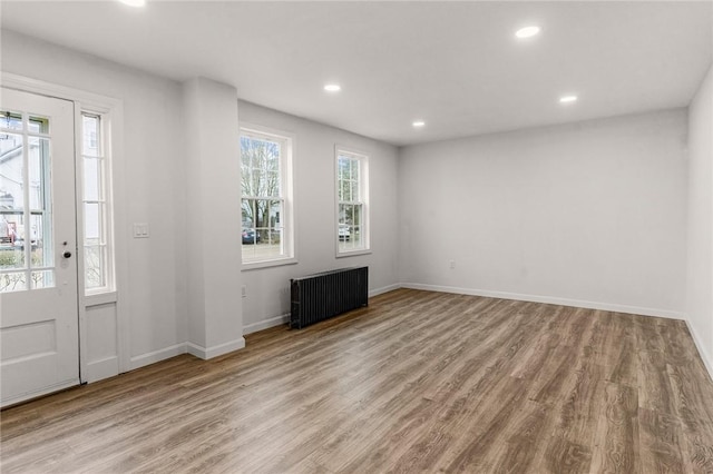 5 Cottage St, Westerly, RI 02891 - foyer entrance featuring radiator heating unit, recessed lighting, wood finished floors, and baseboards