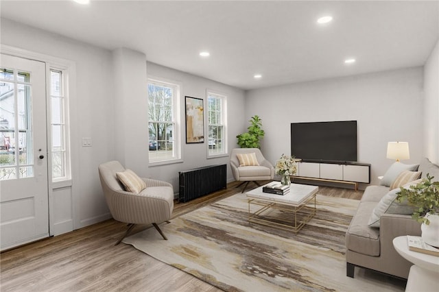 5 Cottage St, Westerly, RI 02891 - living area with wood finished floors, radiator heating unit, baseboards, and recessed lighting