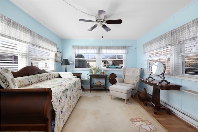 27 Woodward Rd, Lincoln, RI 02865 - bedroom featuring a baseboard radiator, a ceiling fan, and wood finished floors