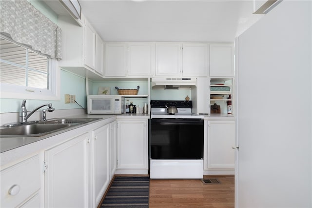 27 Woodward Rd, Lincoln, RI 02865 - kitchen featuring white cabinetry, under cabinet range hood, a sink, electric range oven, and white microwave