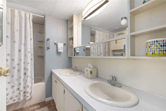 27 Woodward Rd, Lincoln, RI 02865 - bathroom featuring double vanity, a sink, shower / bathtub combination with curtain, and a textured ceiling