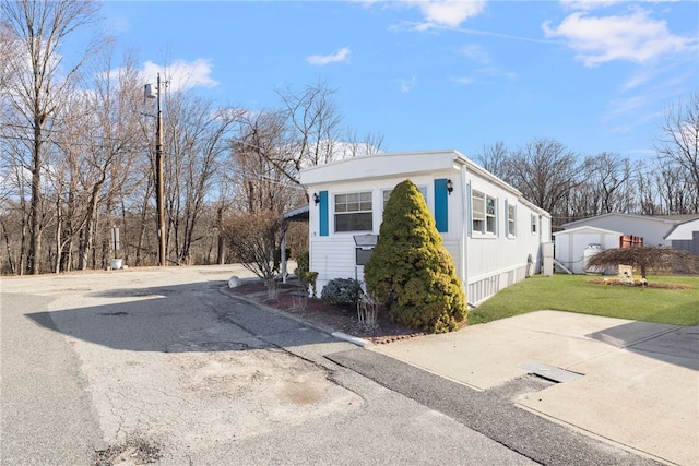 27 Woodward Rd, Lincoln, RI 02865 - view of property exterior with a yard