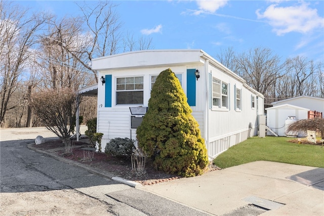 27 Woodward Rd, Lincoln, RI 02865 - manufactured / mobile home with a front yard