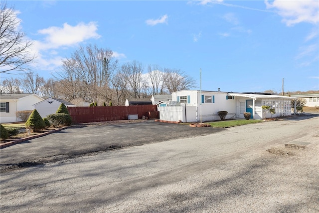 27 Woodward Rd, Lincoln, RI 02865 - exterior space featuring driveway and fence