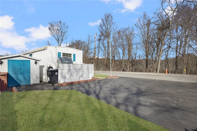 27 Woodward Rd, Lincoln, RI 02865 - exterior space with a lawn and an outbuilding