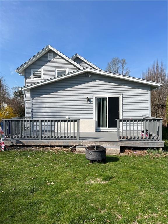 3506 Kingstown Rd, South Kingstown, RI 02892 - rear view of property with a wooden deck and a yard