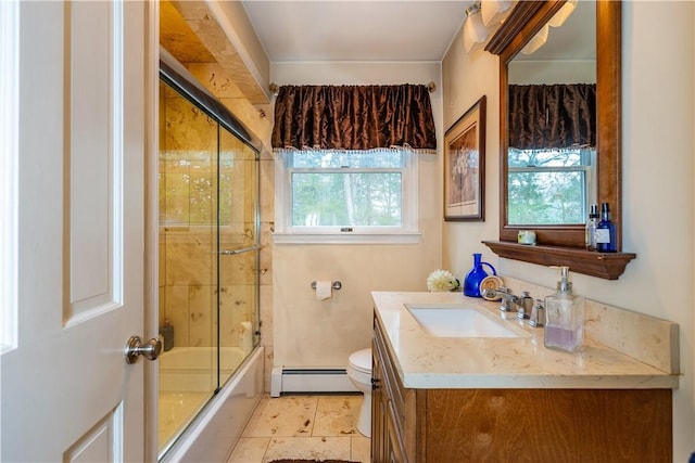 full bath with combined bath / shower with glass door, toilet, vanity, tile patterned floors, and a baseboard heating unit