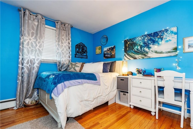 bedroom with wood finished floors