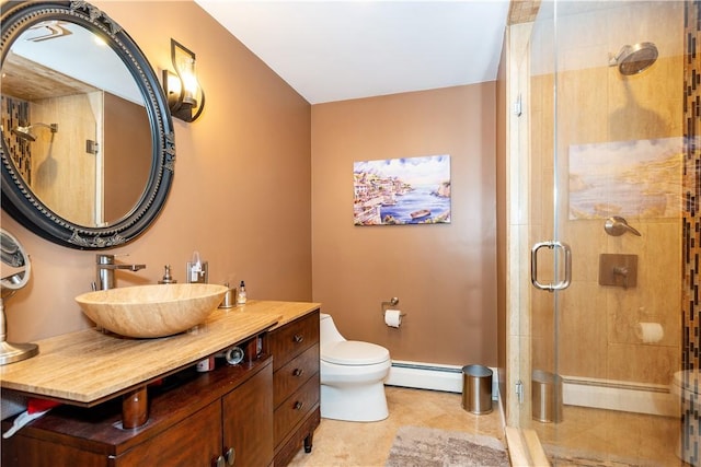 full bath with toilet, vanity, tile patterned floors, a baseboard heating unit, and a stall shower