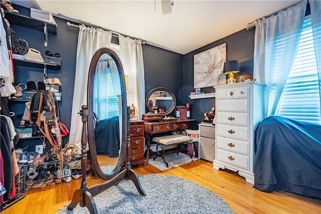 bedroom featuring a ceiling fan and wood finished floors