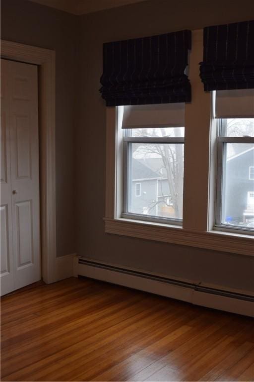 186 Camp St Unit 5, Providence, RI 02906 - unfurnished room with a baseboard radiator and light wood-style flooring