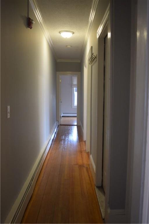 186 Camp St Unit 5, Providence, RI 02906 - hallway featuring baseboard heating, wood finished floors, a baseboard heating unit, and ornamental molding