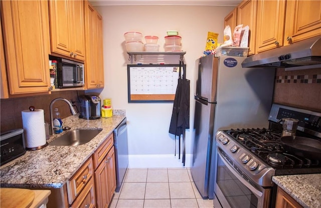 186 Camp St Unit 5, Providence, RI 02906 - kitchen featuring stainless steel appliances, under cabinet range hood, decorative backsplash, light stone countertops, and ornamental molding