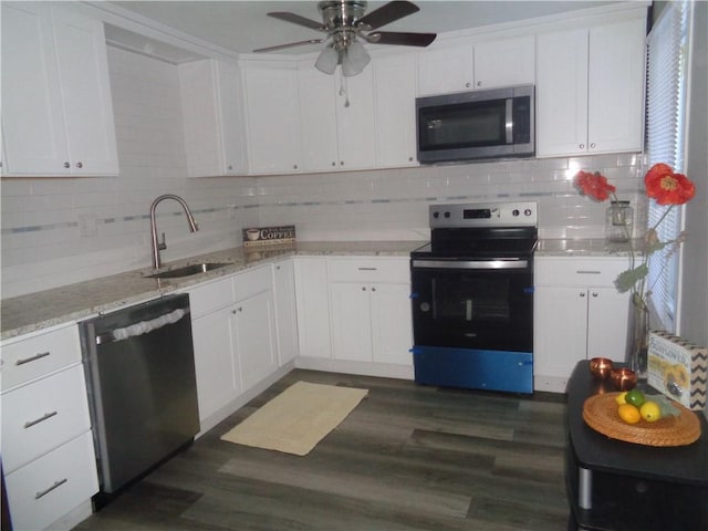 kitchen featuring white cabinetry, a ceiling fan, a sink, and appliances with stainless steel finishes