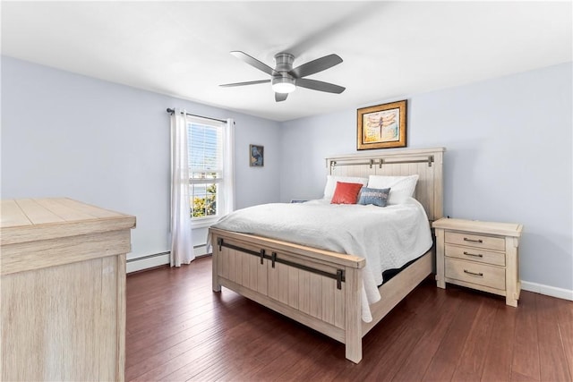bedroom featuring baseboard heating, dark wood-style flooring, baseboards, and a ceiling fan