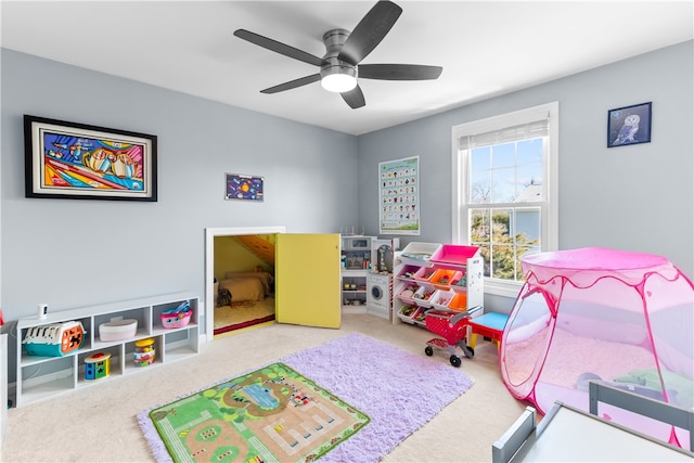 rec room with carpet floors and ceiling fan