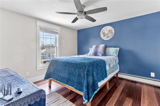 bedroom featuring a ceiling fan, hardwood / wood-style flooring, baseboards, and a baseboard heating unit