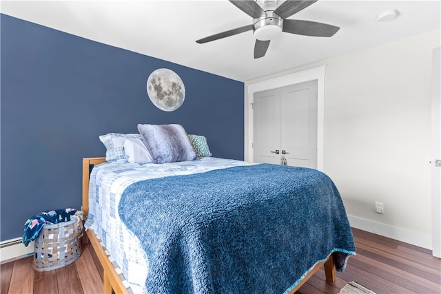 bedroom with baseboards, wood finished floors, and a ceiling fan