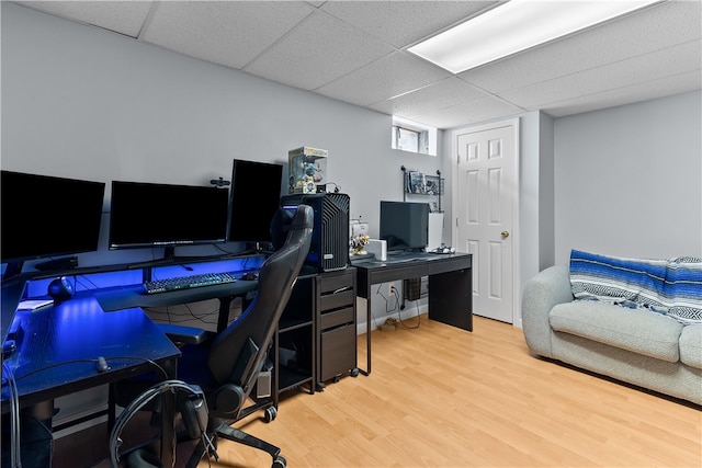 office area featuring wood finished floors and a paneled ceiling