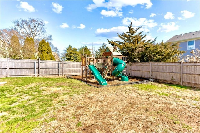 view of playground featuring a fenced backyard and a yard