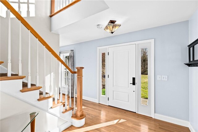 5 Nottingham Way, Freetown, MA 02702 - foyer with wood finished floors, stairs, and baseboards