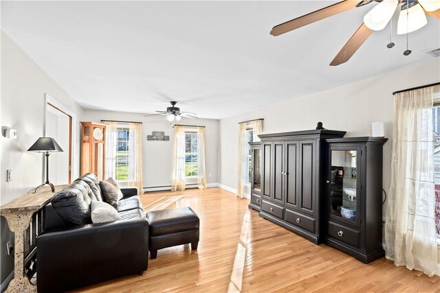 5 Nottingham Way, Freetown, MA 02702 - living room with a ceiling fan, light wood-style flooring, and baseboards