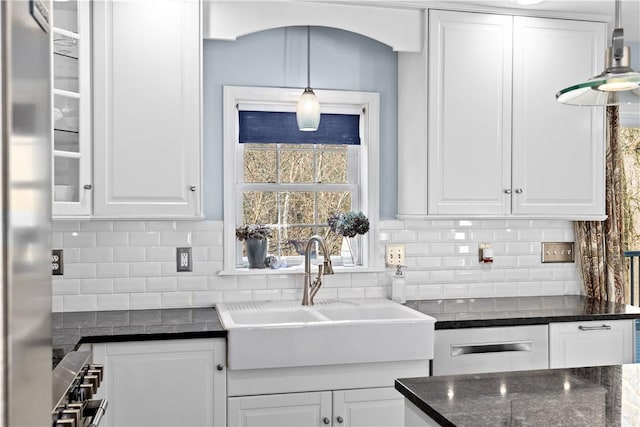 5 Nottingham Way, Freetown, MA 02702 - kitchen featuring a sink, white cabinetry, appliances with stainless steel finishes, and backsplash