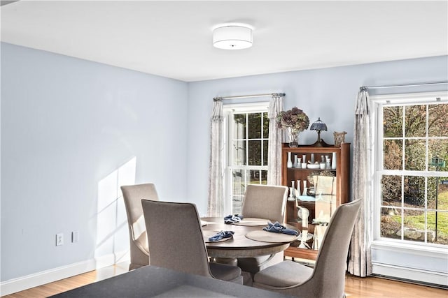 5 Nottingham Way, Freetown, MA 02702 - dining room featuring baseboard heating, wood finished floors, and baseboards