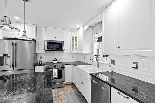 5 Nottingham Way, Freetown, MA 02702 - kitchen featuring appliances with stainless steel finishes, a sink, white cabinetry, backsplash, and recessed lighting