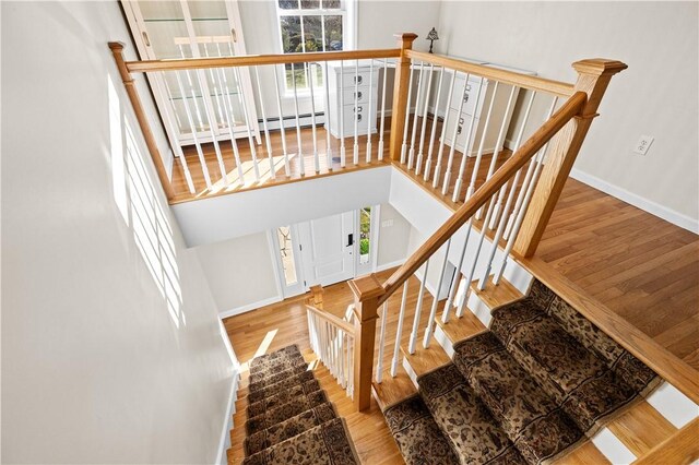 5 Nottingham Way, Freetown, MA 02702 - stairs featuring baseboards, wood finished floors, and a towering ceiling