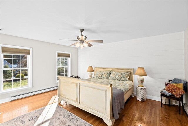 5 Nottingham Way, Freetown, MA 02702 - bedroom featuring a baseboard radiator, wood finished floors, and ceiling fan