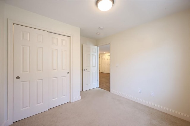 60 Bay Spring Ave Unit A5, Barrington, RI 02806 - unfurnished bedroom featuring carpet, baseboards, and a closet
