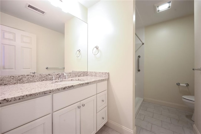 60 Bay Spring Ave Unit A5, Barrington, RI 02806 - bathroom with marble finish floors, toilet, vanity, baseboards, and a shower