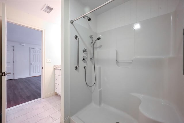 60 Bay Spring Ave Unit A5, Barrington, RI 02806 - bathroom with a shower, vanity, and baseboards