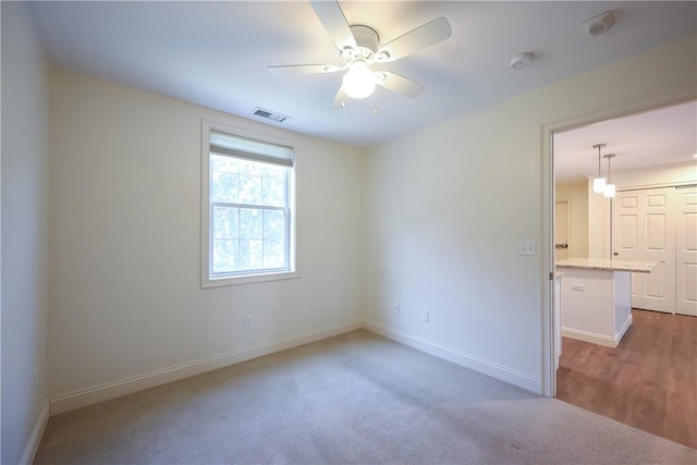 60 Bay Spring Ave Unit A5, Barrington, RI 02806 - carpeted empty room featuring baseboards and ceiling fan