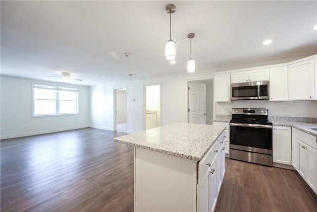 60 Bay Spring Ave Unit A5, Barrington, RI 02806 - kitchen with appliances with stainless steel finishes, dark wood-type flooring, a kitchen island, ceiling fan, and white cabinets