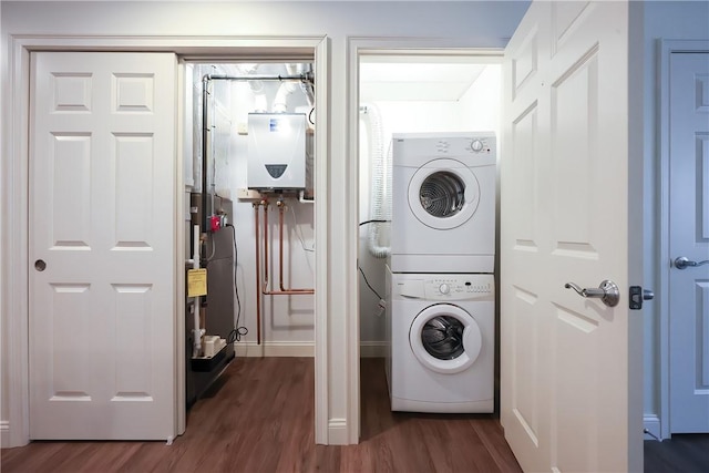 60 Bay Spring Ave Unit A5, Barrington, RI 02806 - laundry area featuring stacked washer and clothes dryer, dark wood-style flooring, and tankless water heater
