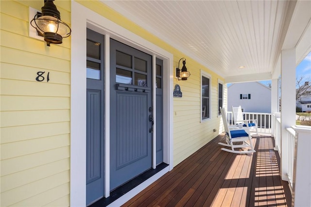 wooden terrace featuring a porch