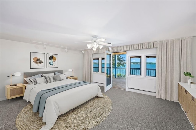 carpeted bedroom with rail lighting, baseboard heating, access to outside, and ceiling fan