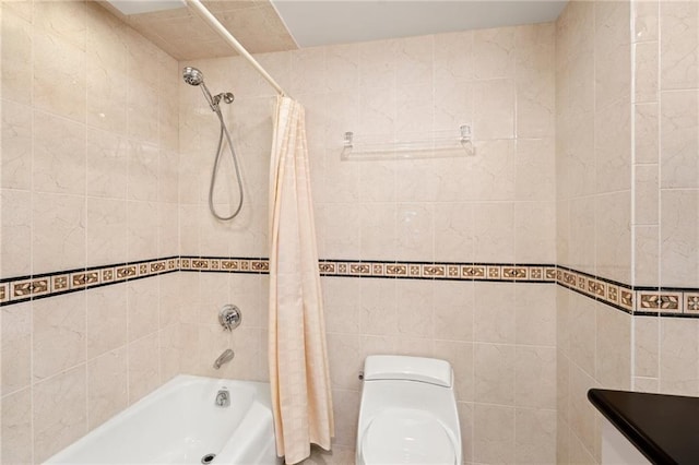 bathroom featuring toilet, shower / bath combo with shower curtain, and tile walls