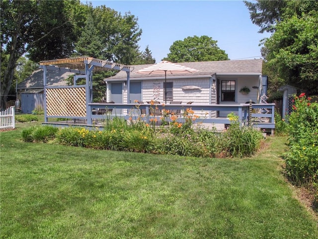 44 Benson Ave, Westerly, RI 02891 - back of house with a pergola, roof with shingles, a deck, and a lawn