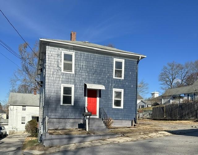 25 School St, West Warwick, RI 02893 - view of front of property featuring a chimney and fence
