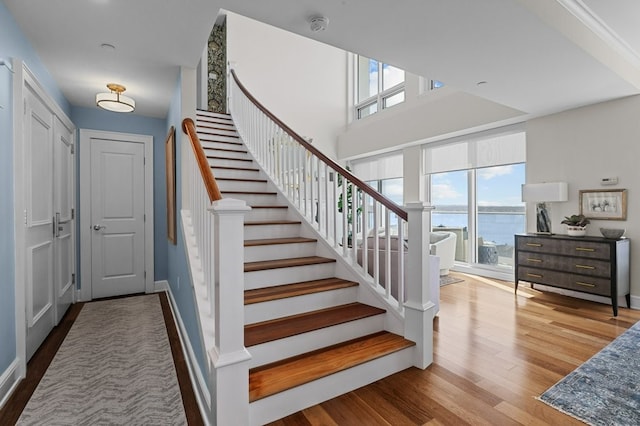 1 Tower Dr Unit 1203, Portsmouth, RI 02871 - staircase with a wealth of natural light, a water view, and wood finished floors