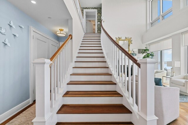 1 Tower Dr Unit 1203, Portsmouth, RI 02871 - stairs with baseboards, a high ceiling, recessed lighting, and parquet flooring