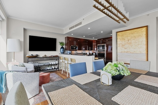 1 Tower Dr Unit 1203, Portsmouth, RI 02871 - dining space featuring visible vents, crown molding, and light wood-type flooring