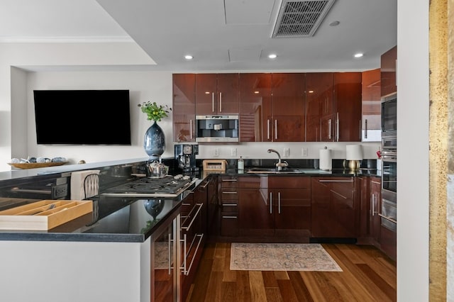 1 Tower Dr Unit 1203, Portsmouth, RI 02871 - kitchen with dark wood finished floors, visible vents, dark countertops, and a sink