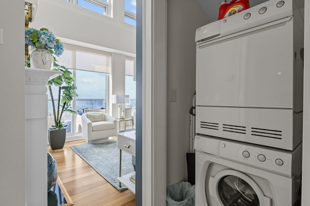 1 Tower Dr Unit 1203, Portsmouth, RI 02871 - laundry area with wood finished floors, stacked washer and clothes dryer, and laundry area