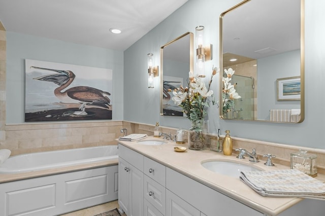 1 Tower Dr Unit 1203, Portsmouth, RI 02871 - bathroom featuring a garden tub, double vanity, a sink, and a stall shower